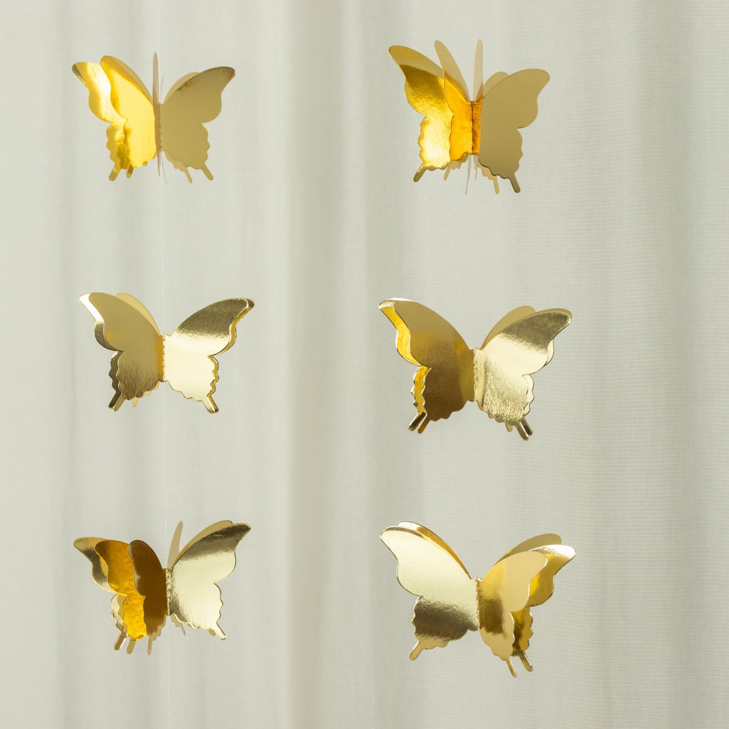 Gold 3D paper butterfly hanging garland streamers for party decor.