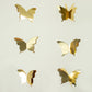 Gold 3D paper butterfly garland streamers for party decoration.