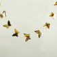Gold 3D paper butterfly garland streamers for party decoration.