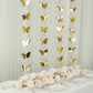 Gold 3D paper butterfly garland streamers for party decorations.