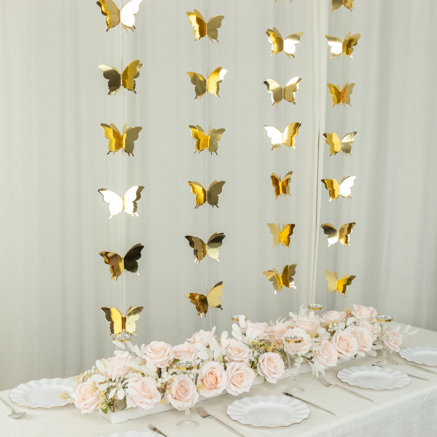 Gold 3D paper butterfly garland streamers for party decorations.