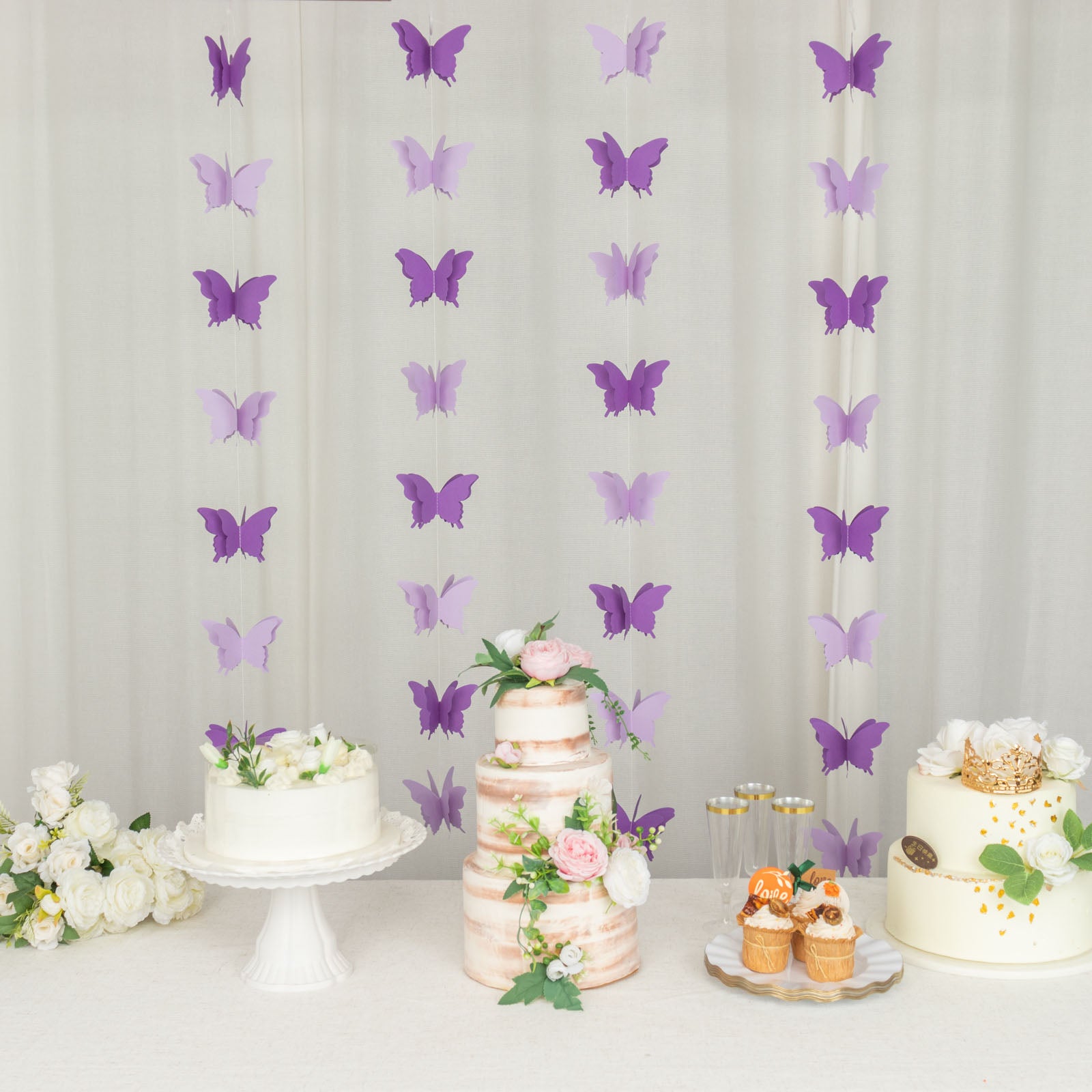 Purple 3D paper butterfly garland streamers for party decoration.