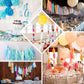 Antique gold paper fringe tassels with garland string for festive decorations.