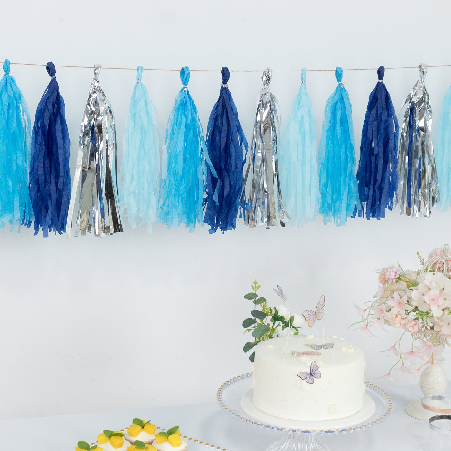 Blue and silver pre-tied foil tassel garland banner decoration.