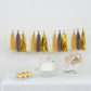 Natural and gold foil tassel garland banner decoration on display.