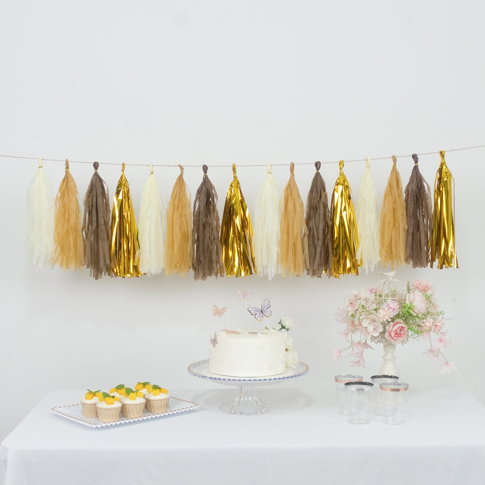 Natural and gold foil tassel garland banner decoration on display.