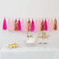 Pink and rose gold tassel garland banner decoration.