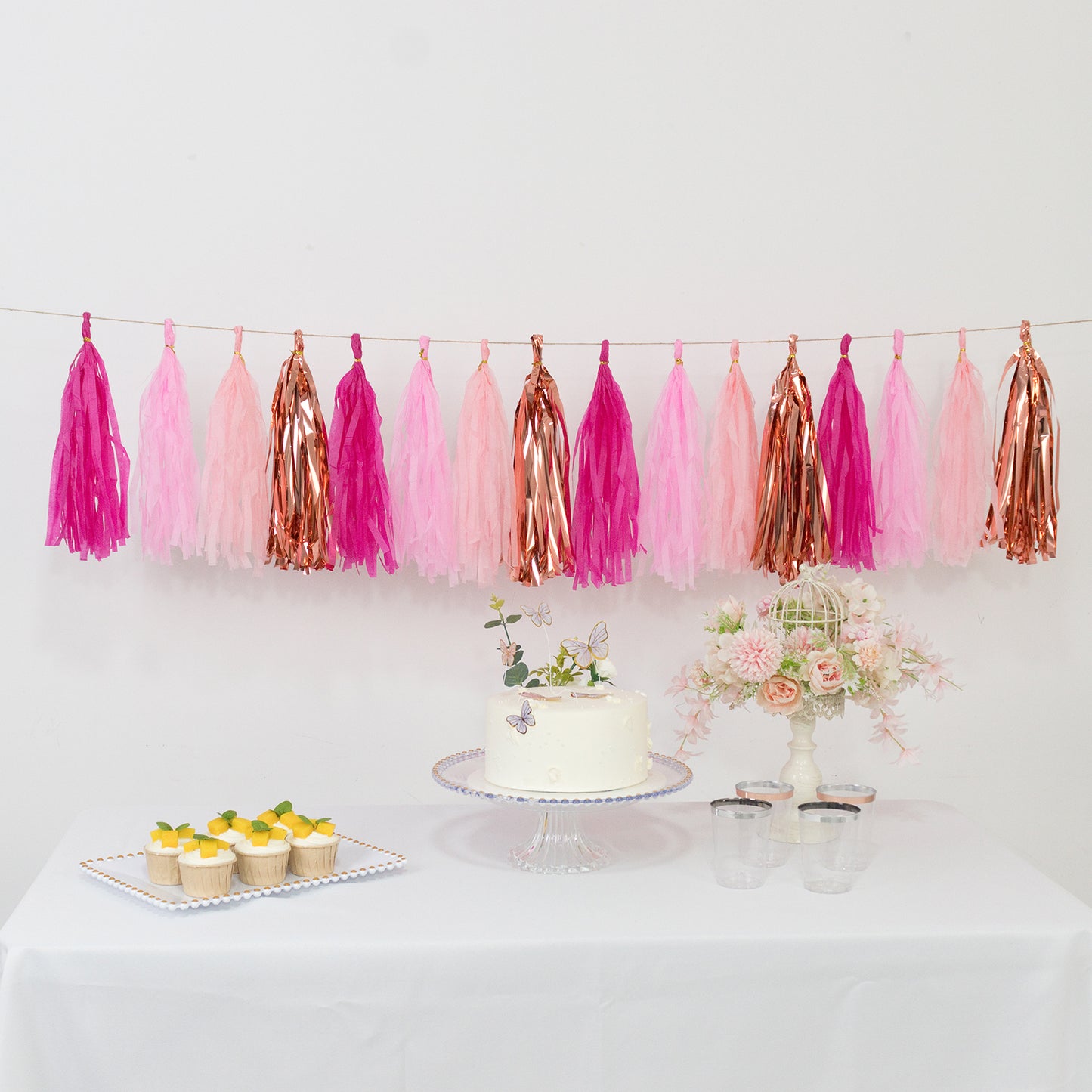 Pink and rose gold tassel garland banner decoration.
