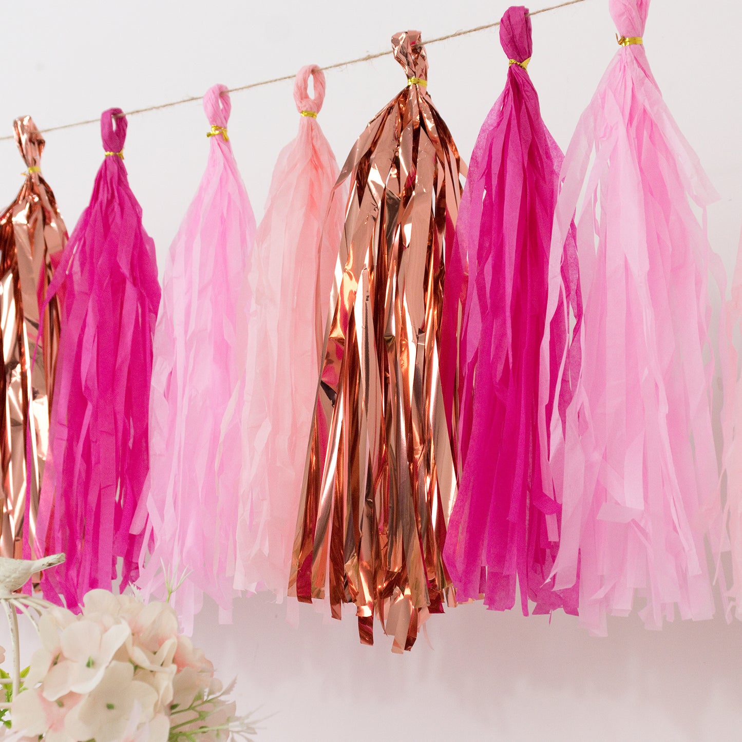 Pink and rose gold foil tassel garland banner decoration.