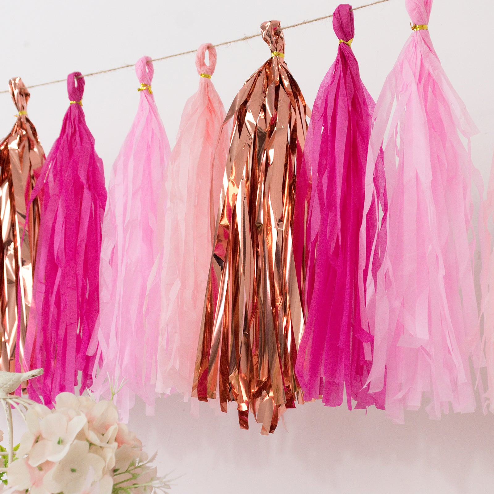 Pink and rose gold foil tassel garland banner decoration.
