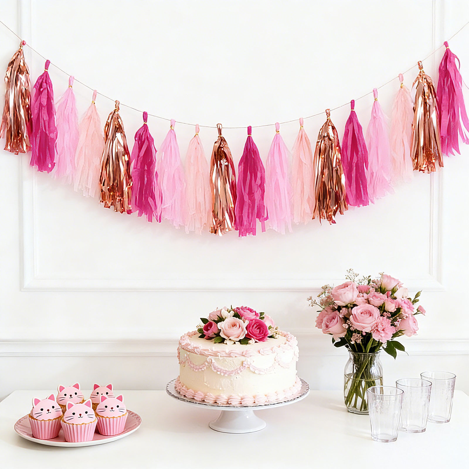 Pink and rose gold foil tassel garland decoration for parties.