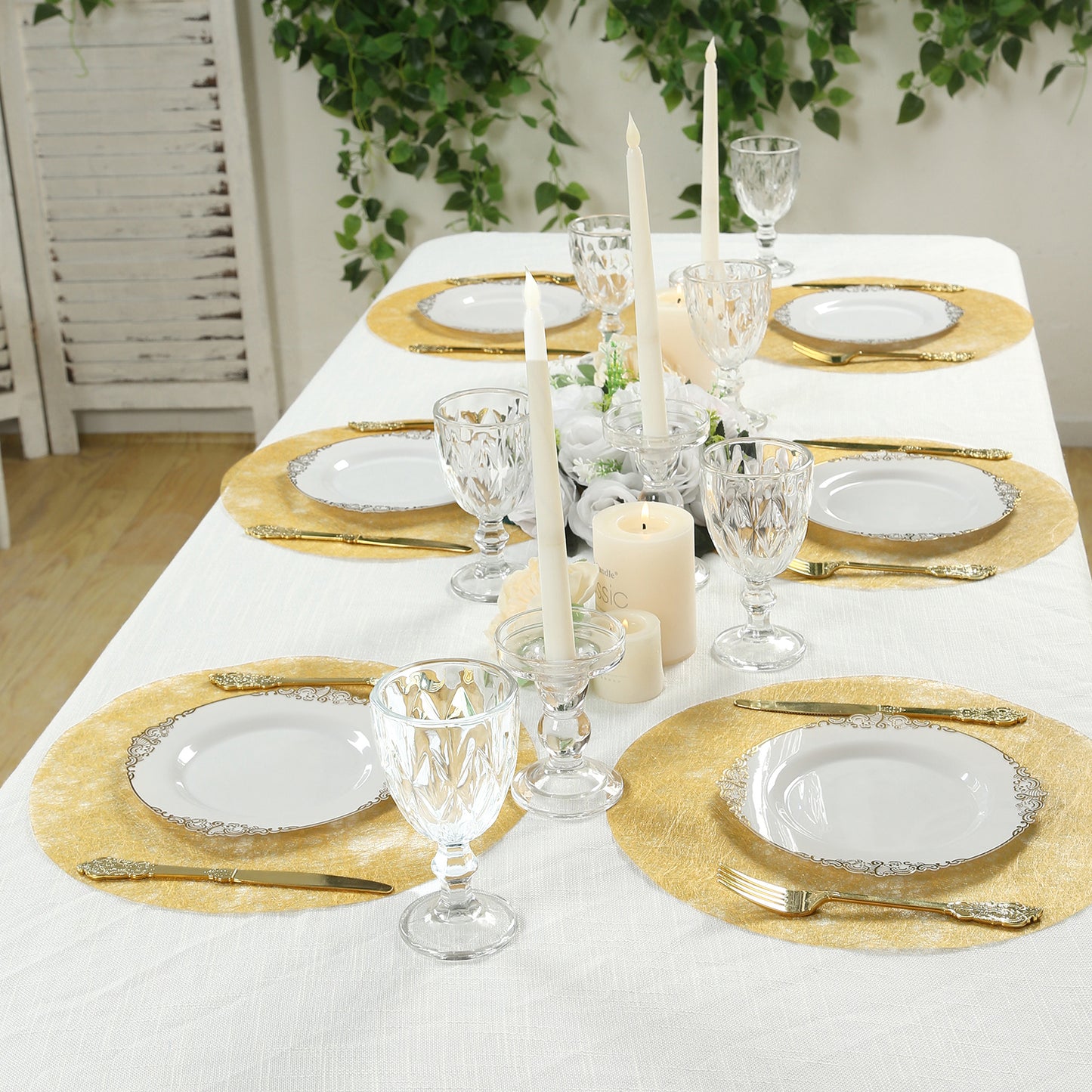 Metallic gold round placemats on a dining table setting.