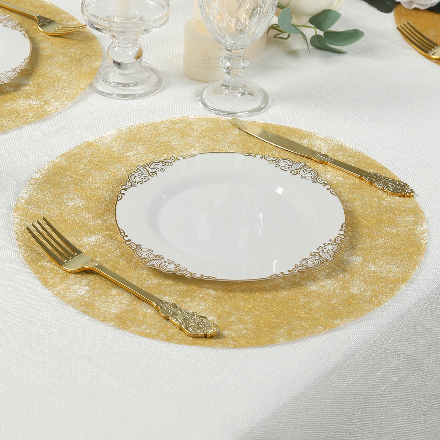 Disposable metallic gold placemat on a dining table setting.