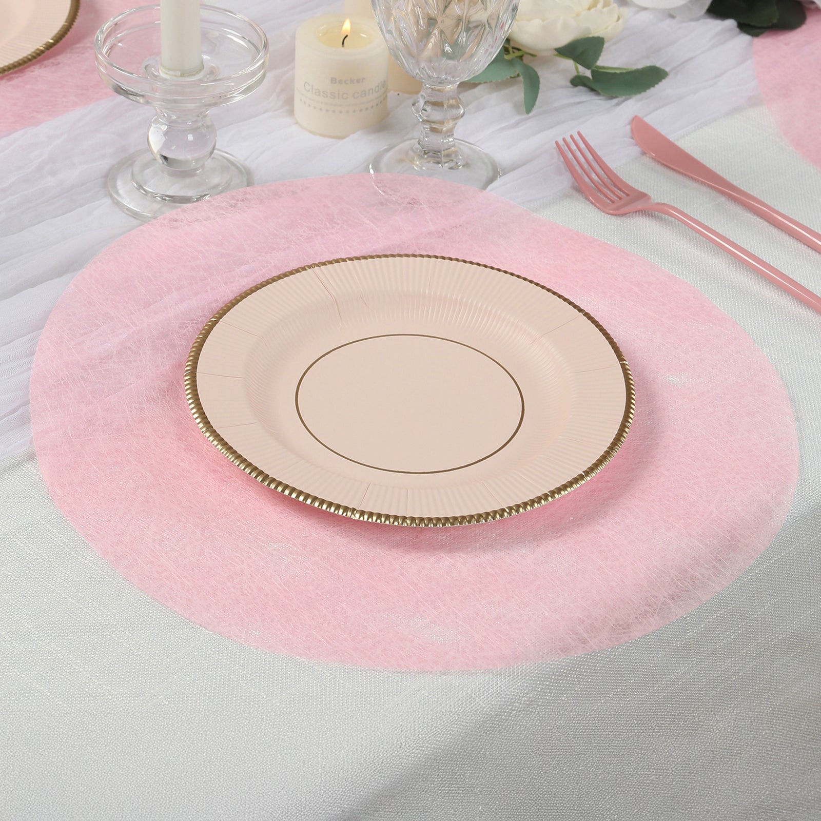 Pink disposable placemats for dining and events on a table setting.
