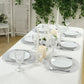 Metallic silver round placemats on a dining table setting.