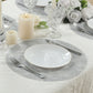 Metallic silver round placemat on a dining table setting.
