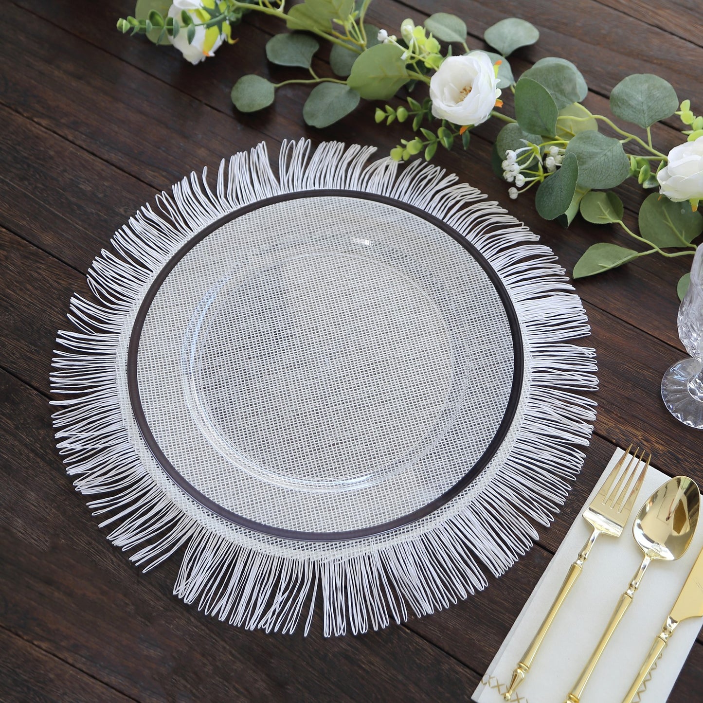 White rustic farmhouse burlap tassel dining table mat with jute fringe edge.
