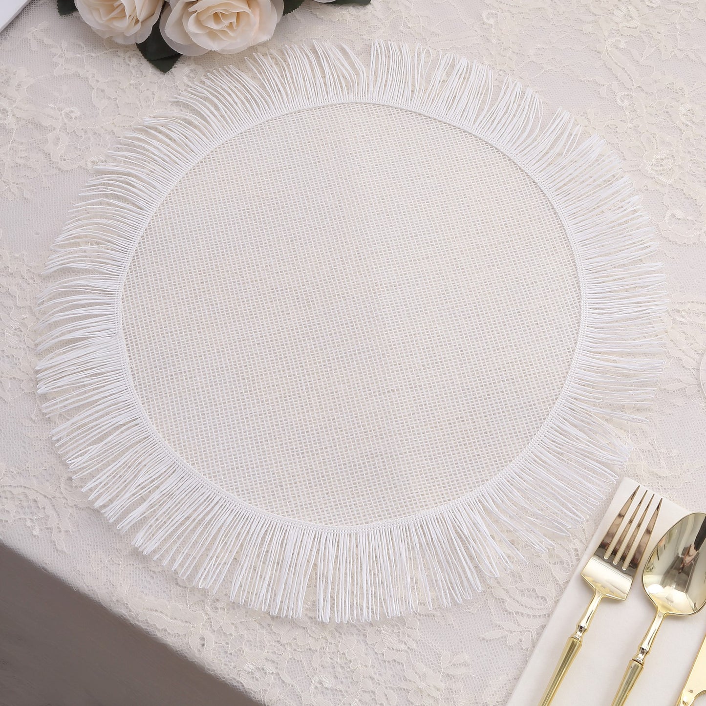 White rustic farmhouse burlap tassel dining table mat with jute fringe edge.