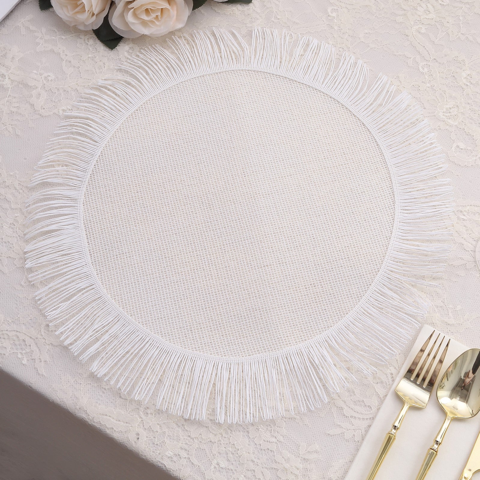 White rustic farmhouse burlap tassel dining table mat with jute fringe edge.