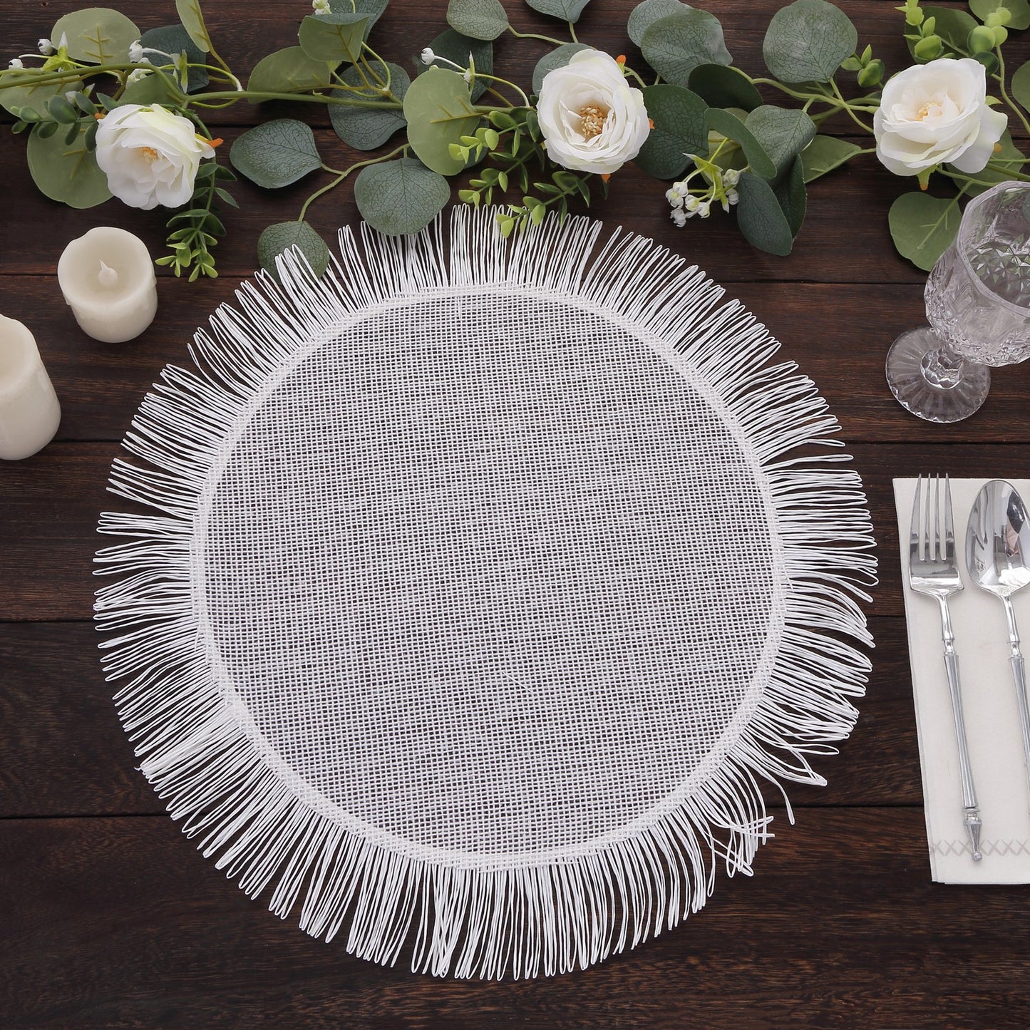 White rustic burlap round table mat with fringe edges.