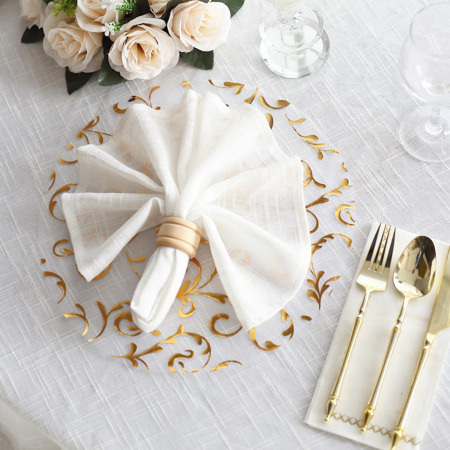 Metallic gold sheer organza round placemat with embossed floral design.