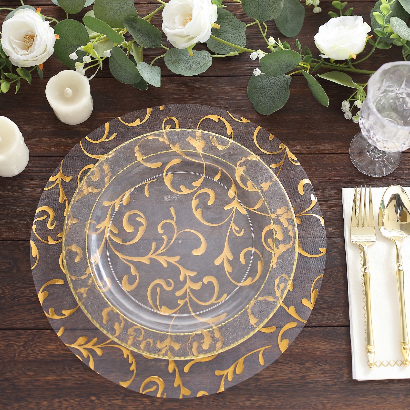 Gold sheer organza placemat with embossed flower design on a rustic table setting.