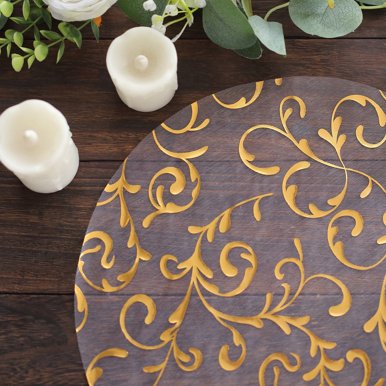 Metallic gold sheer organza placemat with embossed flower design.