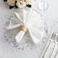 Metallic silver sheer organza table mat with embossed floral design.