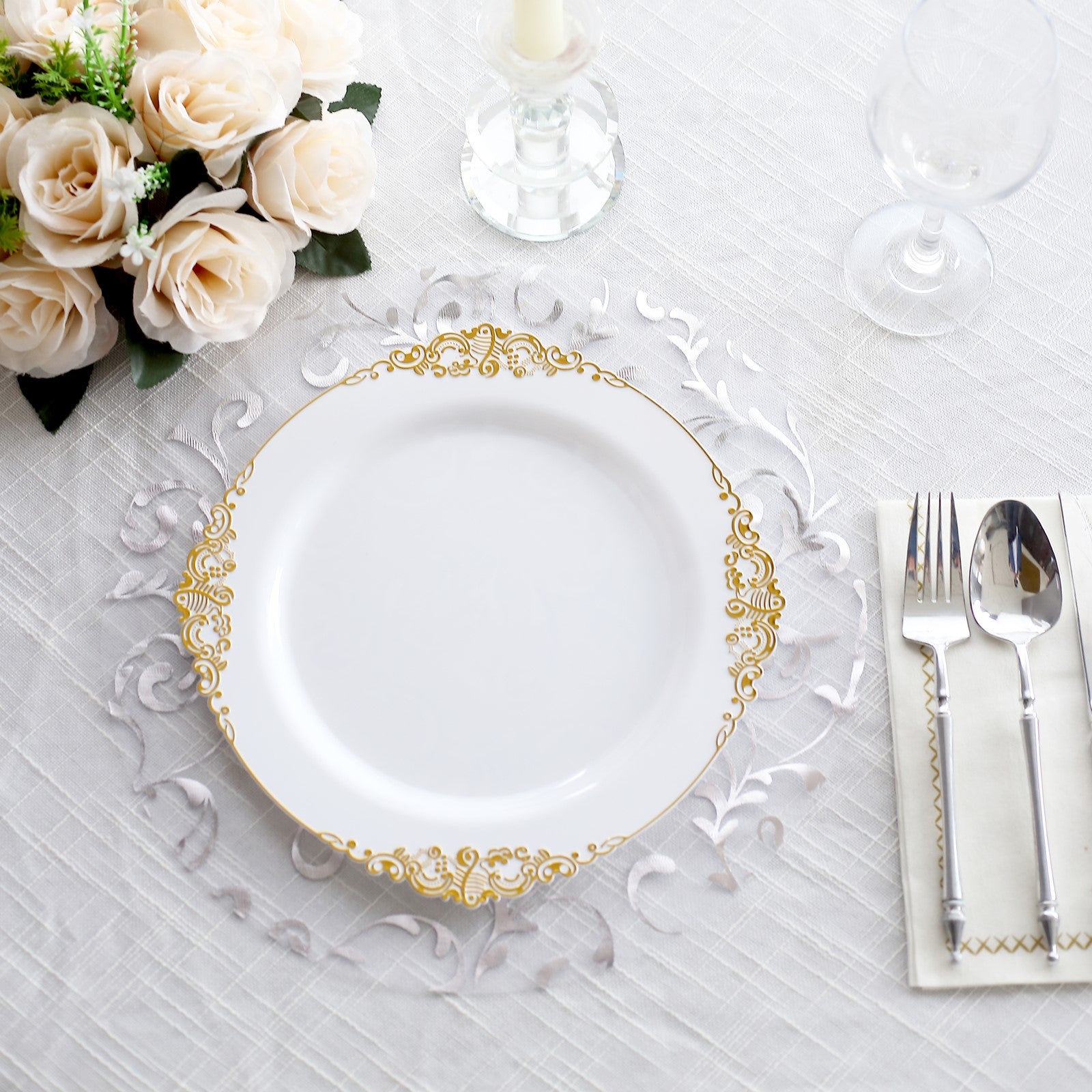 Metallic silver sheer organza table mat with embossed foil flower design.