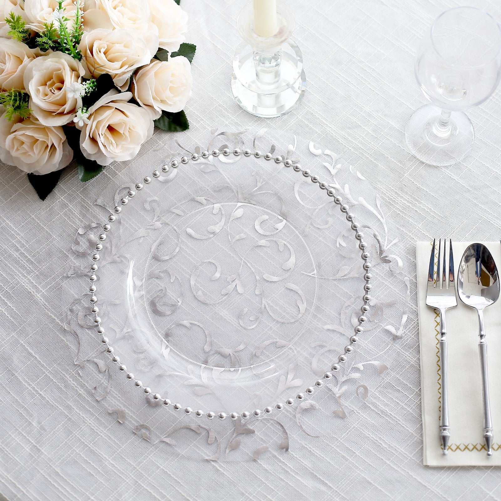 Metallic silver sheer organza dining table mat with embossed flower design.
