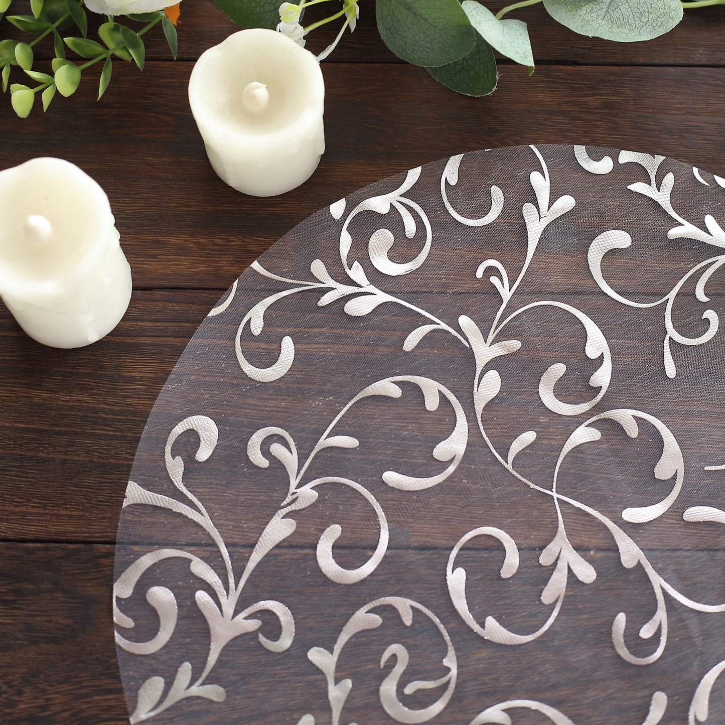Metallic silver sheer organza dining table mat with embossed foil flower design.