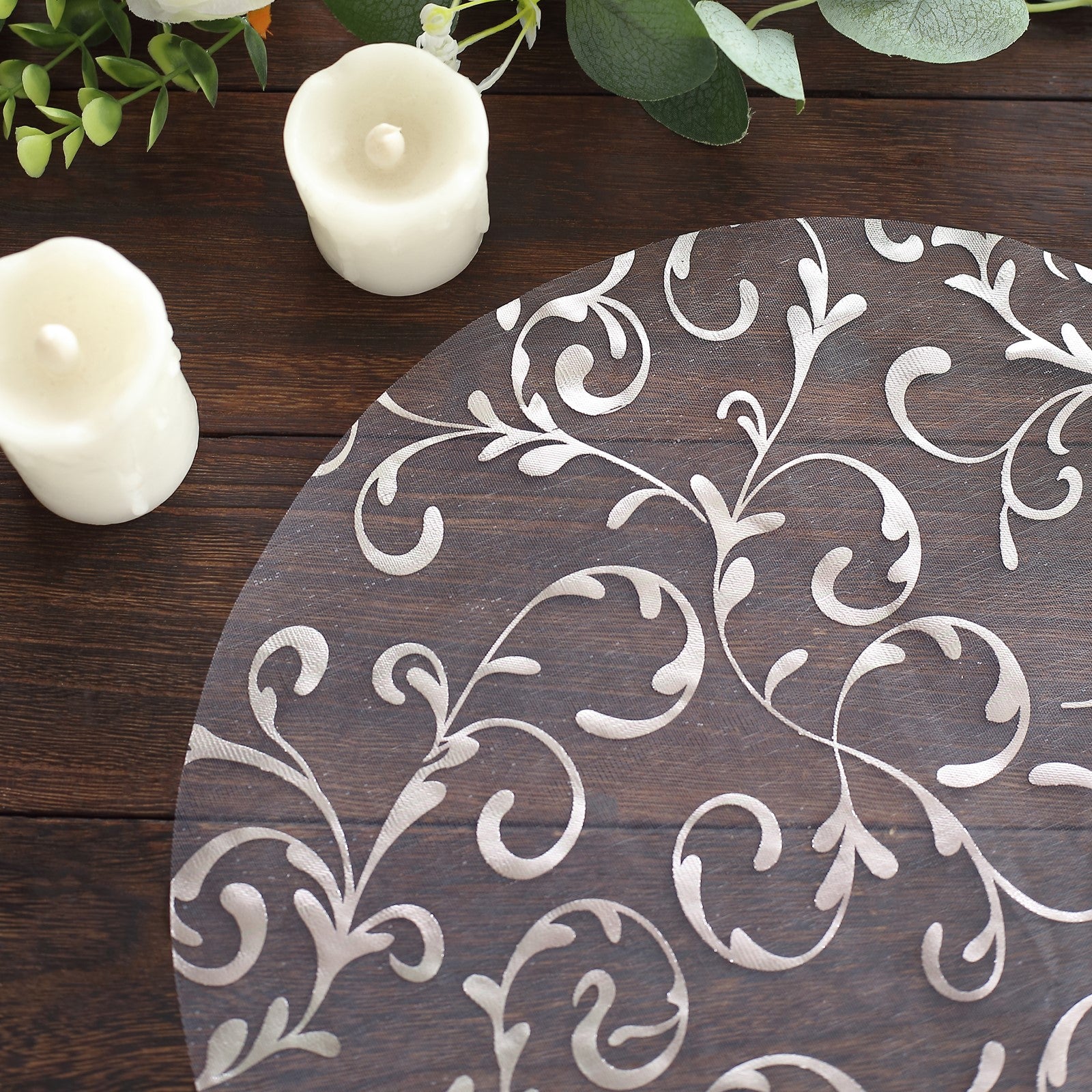 Metallic silver sheer organza dining table mat with embossed foil flower design.
