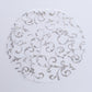 Metallic silver sheer organza placemat with embossed foil flower design.
