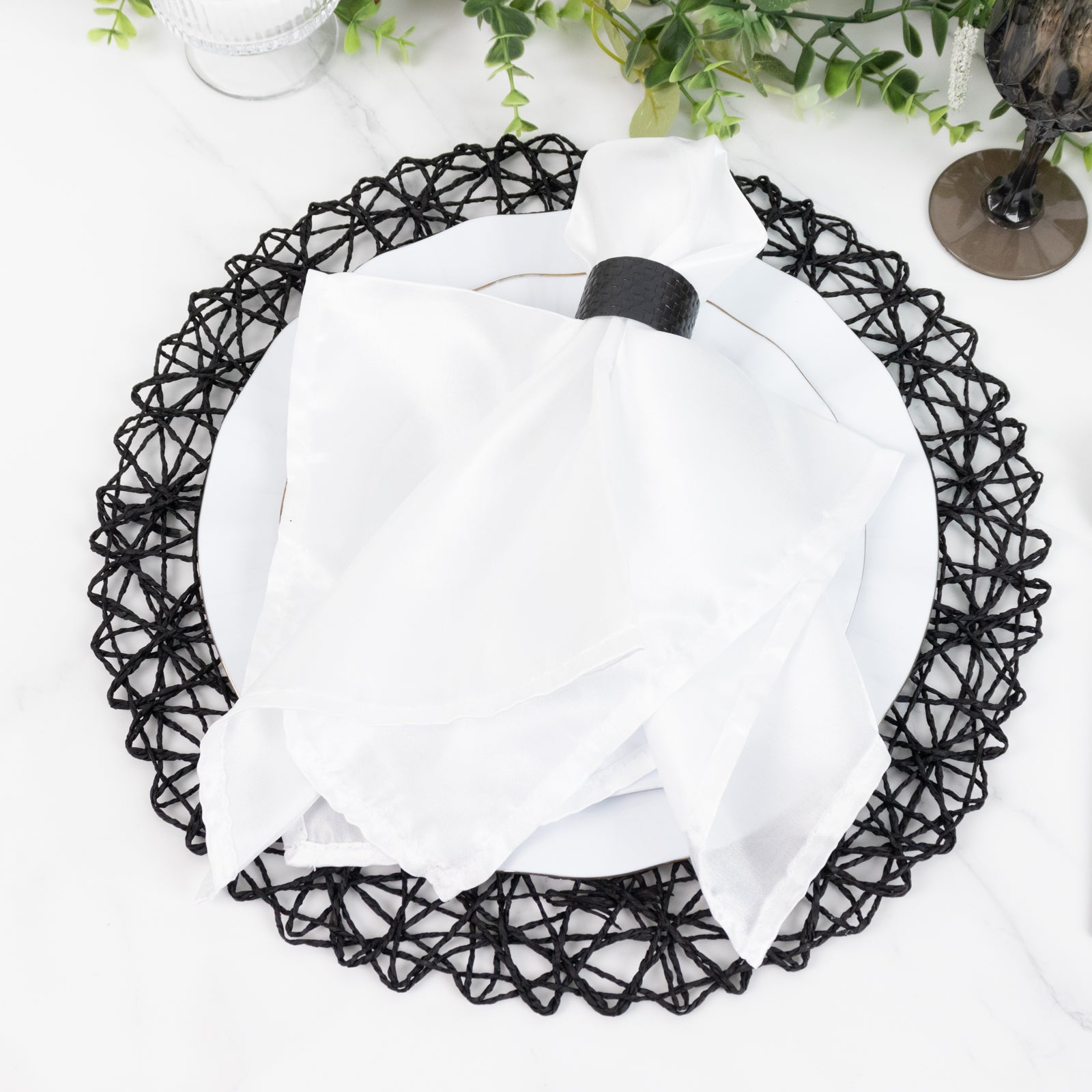 Dark blue woven fiber round placemat for dining and events.