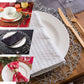 Gold metallic round placemats for elegant table settings.