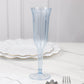 Dusty blue plastic champagne flute with a flared design on a marble surface.