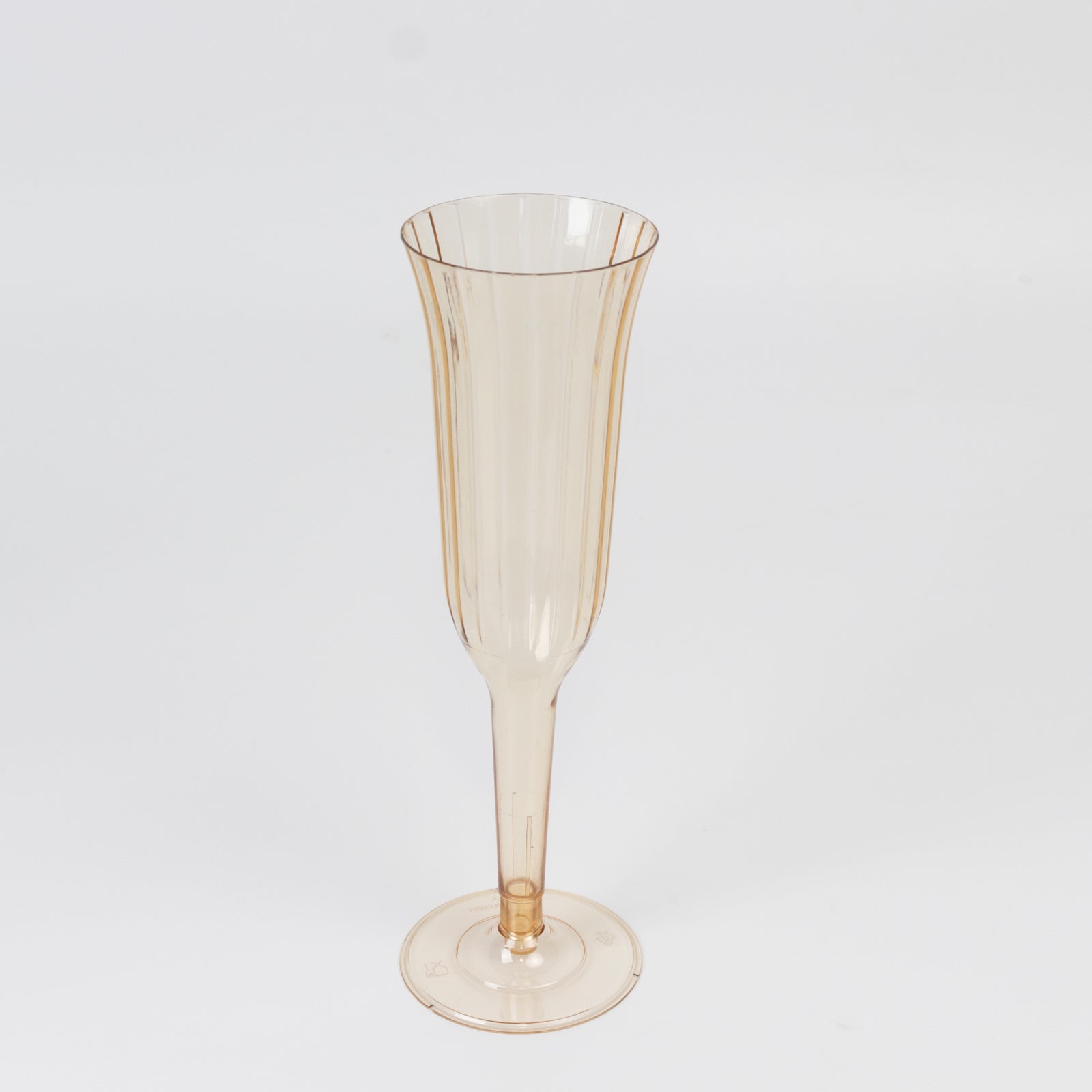 Transparent amber gold flared design champagne flute, lightweight and disposable.