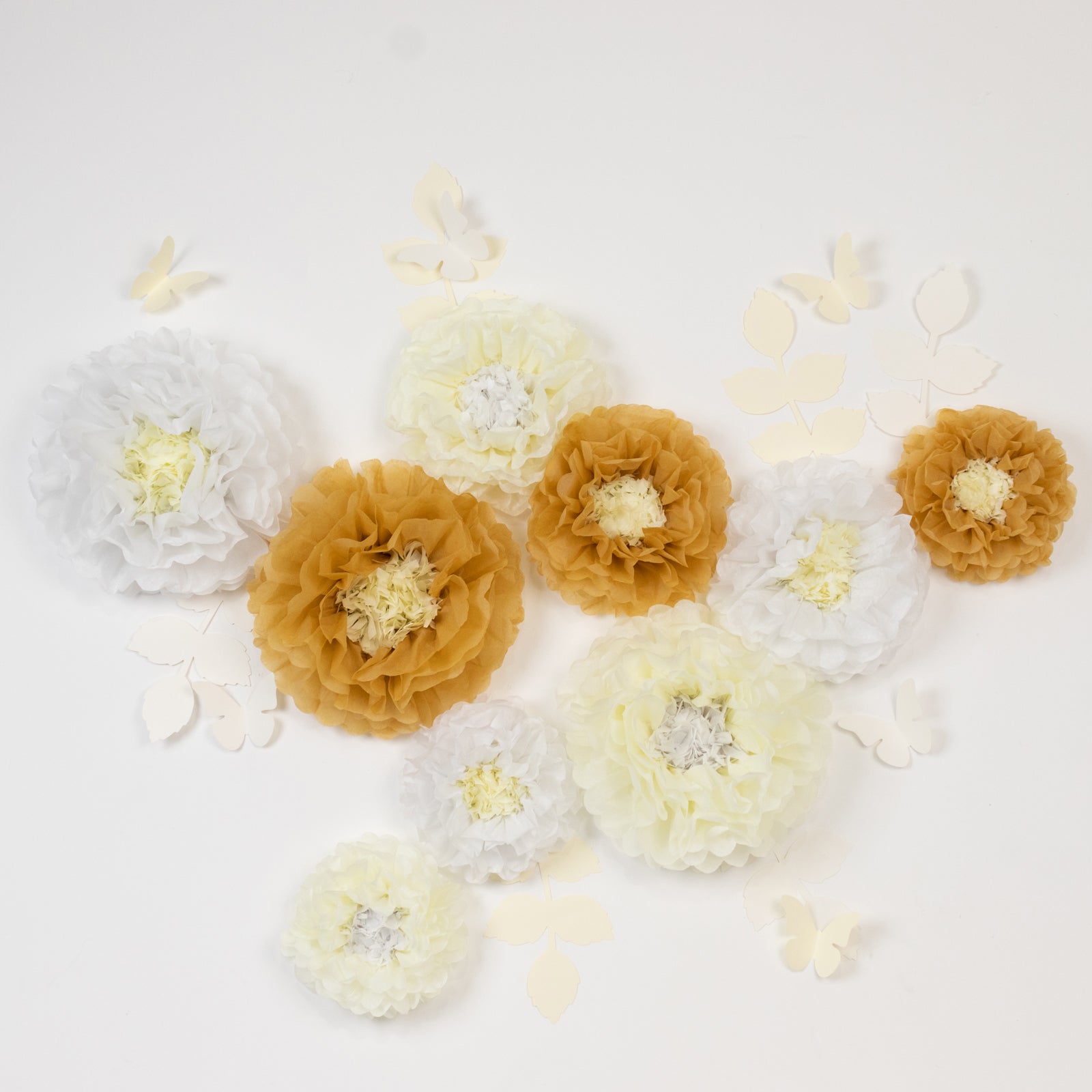 Set of white and ivory tissue paper flowers with butterflies and olive leaves.