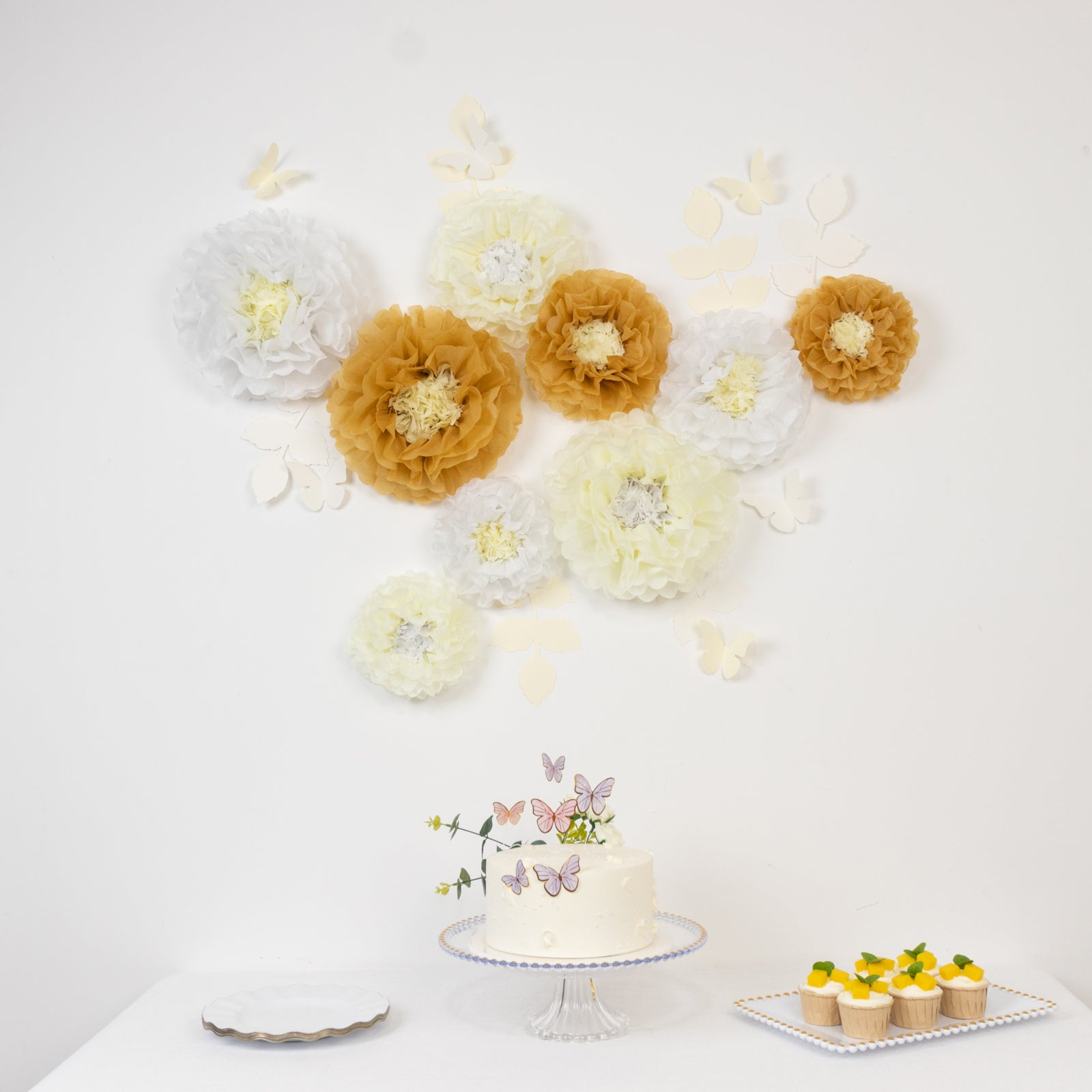 Set of 21 tissue paper flower pom poms decor in white and ivory with butterflies.
