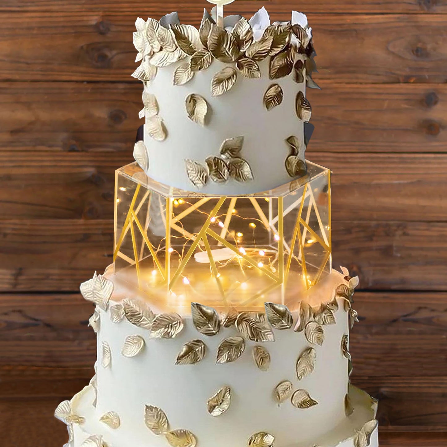 Clear gold acrylic hexagonal cake box stand with hollow bottom.