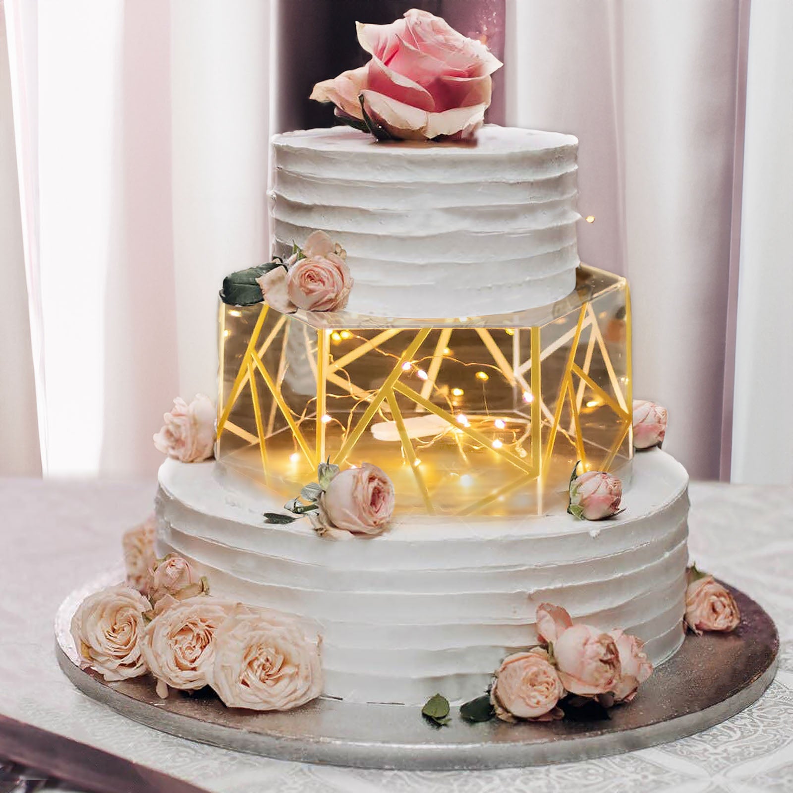 Clear gold acrylic hexagonal cake box stand with hollow bottom.