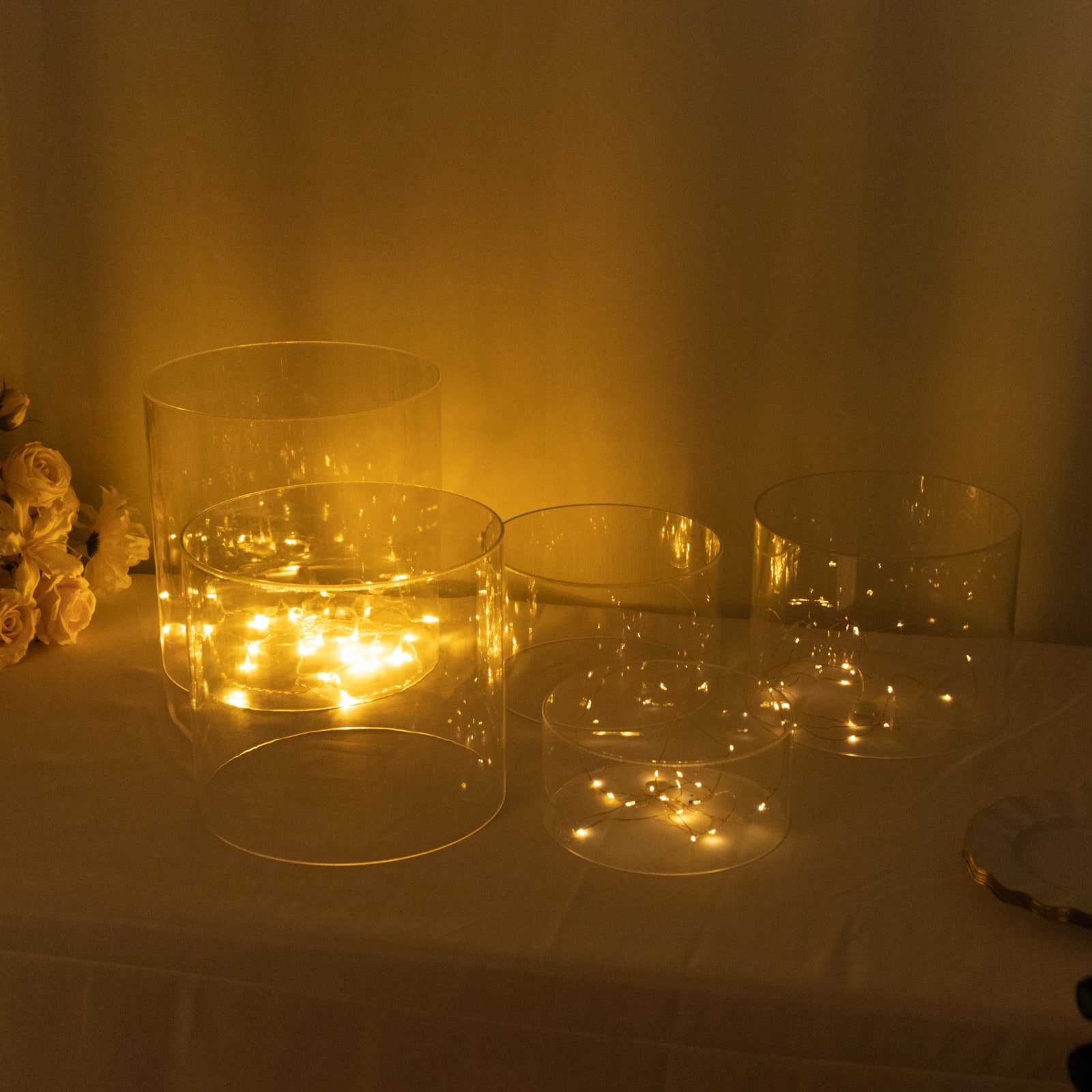 Clear acrylic cake stands, set of 5, cylinder design, for event display.