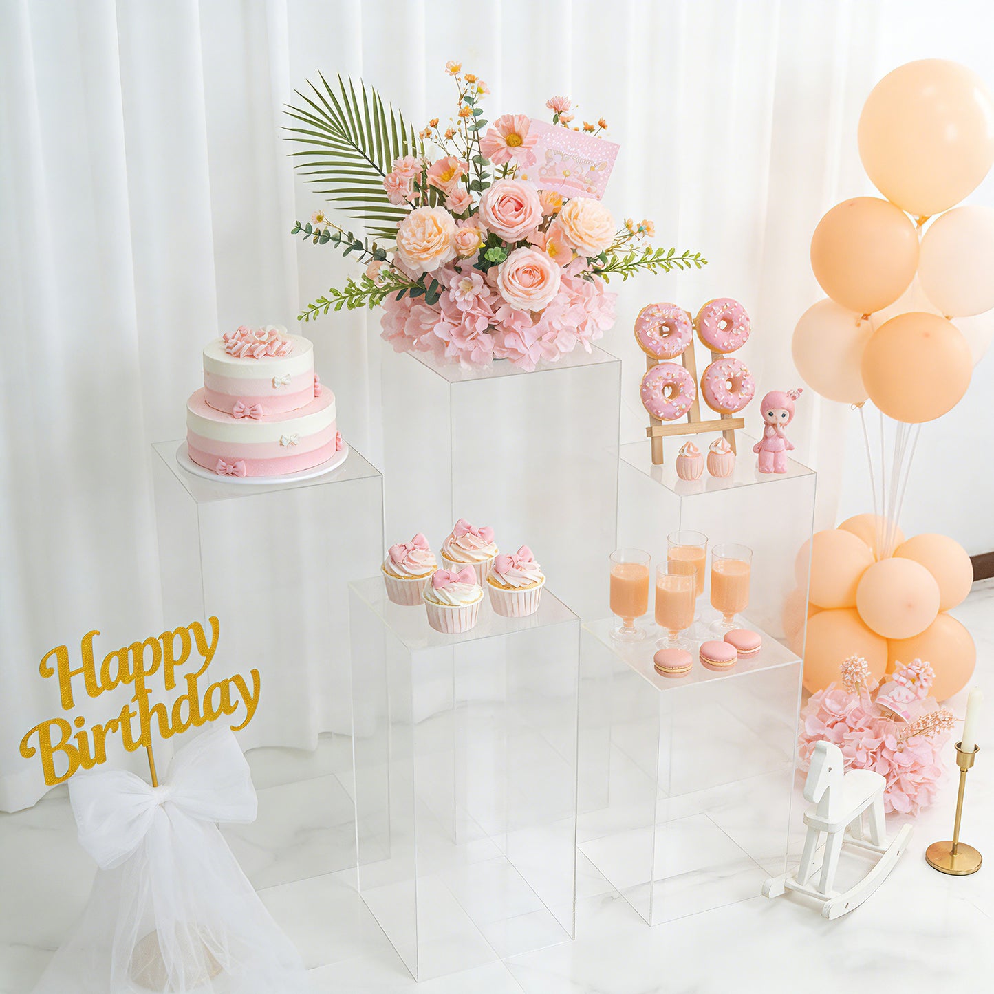Clear acrylic pedestal stands for elegant event décor and display.