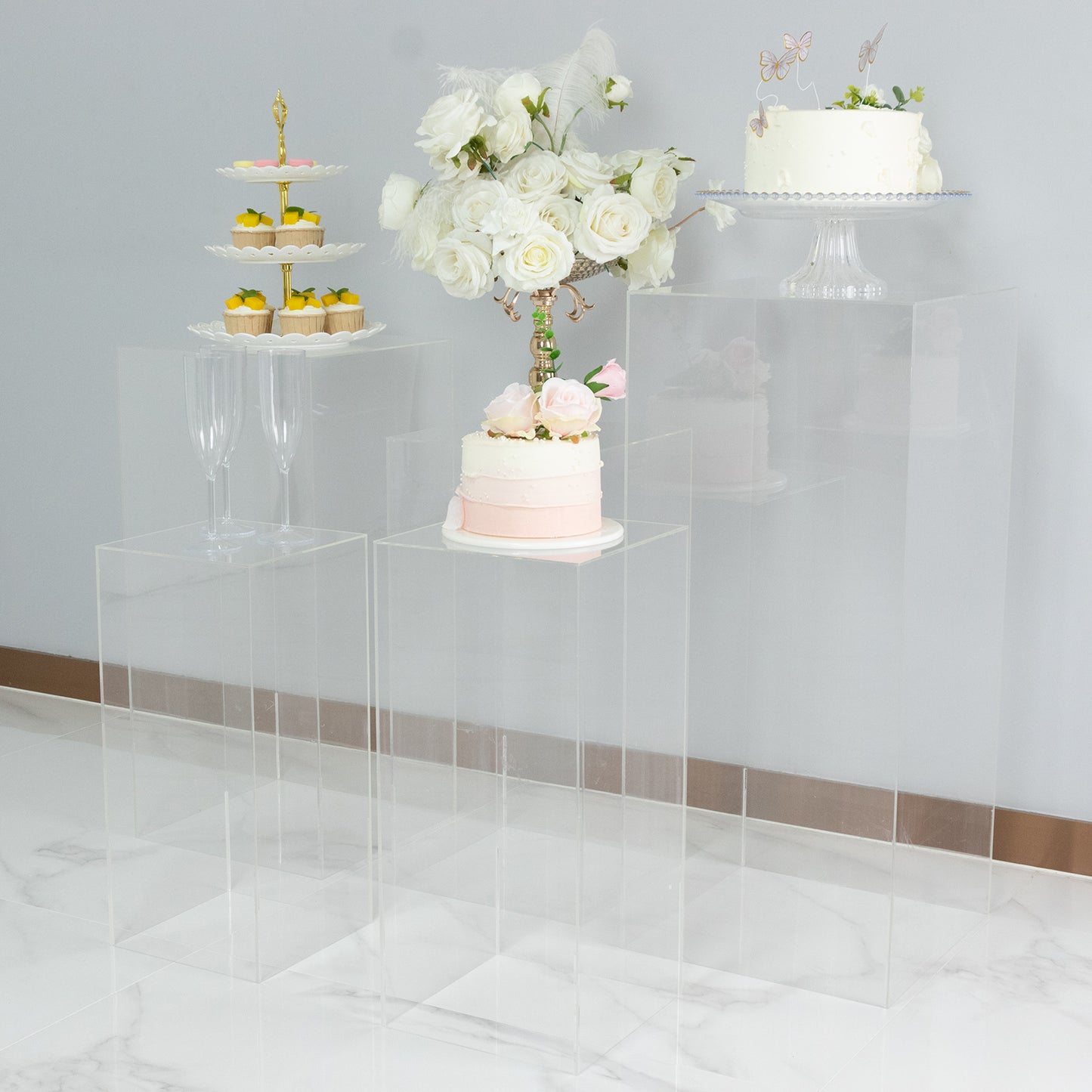 Clear acrylic pedestal stands for display, ideal for retail and events.