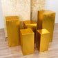 Set of 5 metallic gold spandex pedestal stand covers.