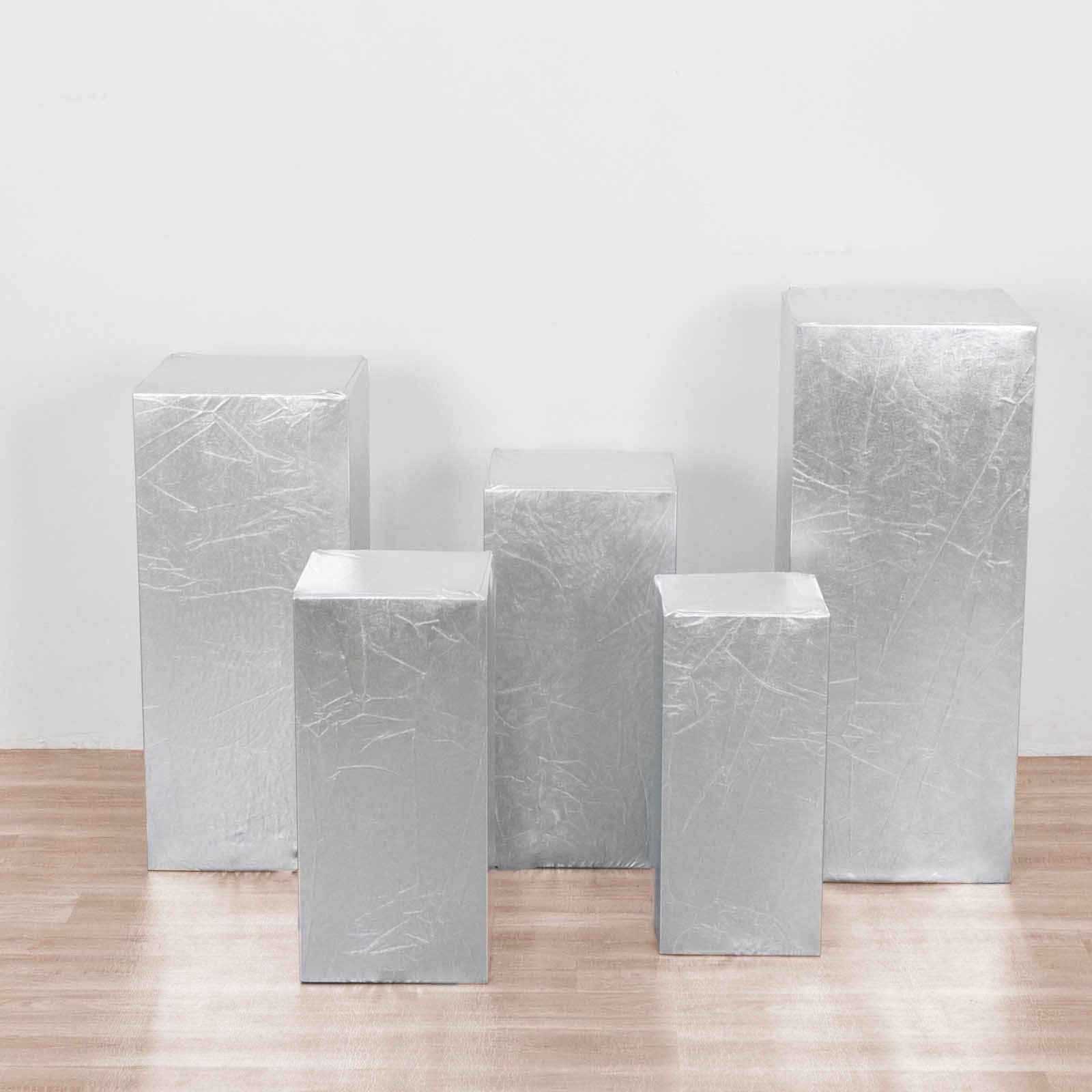 Set of 5 metallic silver pedestal stand covers for decorations.