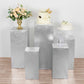 Metallic silver spandex pedestal stand covers for events and displays.