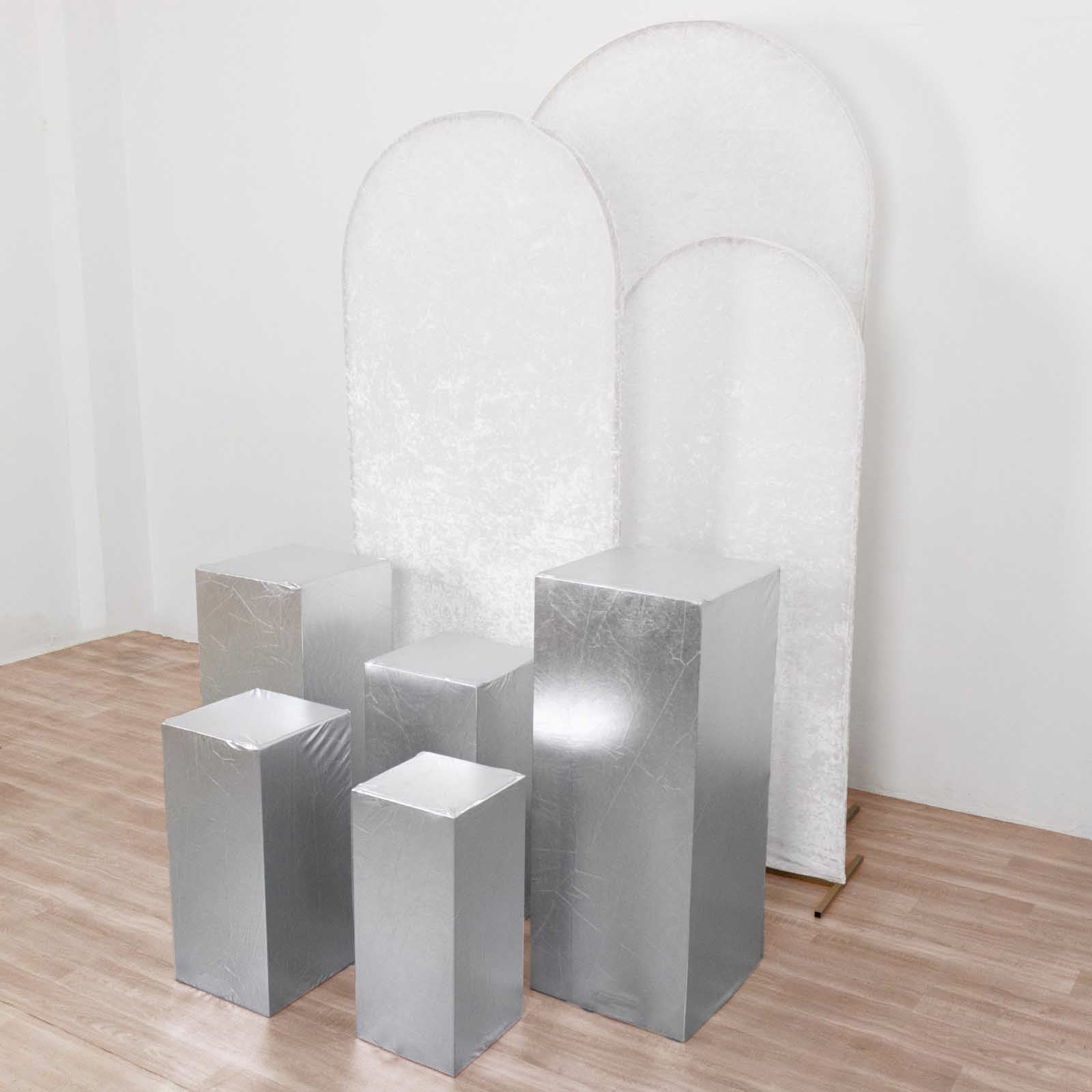 Set of 5 metallic silver spandex pedestal stand covers.
