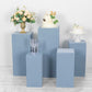 Dusty blue pedestal stand covers with floral and cake displays.