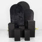Set of 5 black spandex pedestal stand covers for events and displays.